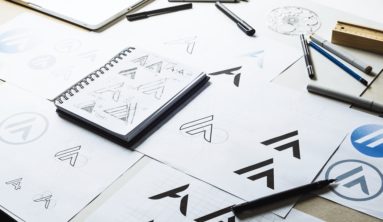 A close-up view showcases various logo designs that cleverly utilize negative space and hidden elements, revealing deeper meanings at first glance. Each logo features subtle hidden messages, such as a hidden arrow in the FedEx logo or the playful imagery in the Tostitos logo, highlighting the brand's visual identity and mission.